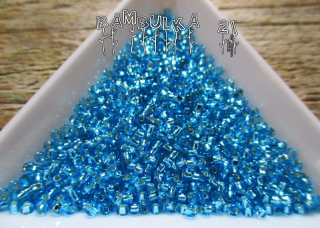 PRECIOSA rokajl 11/0, sv. modrý  tyrkys se stříbrným průtahem, balení cca 50g